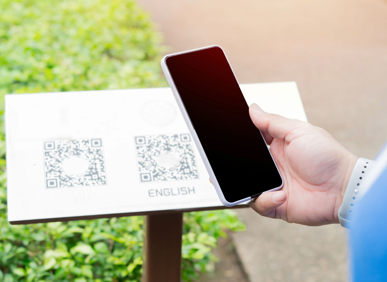 Scanning a QR code at a college to help Gamify Engagement